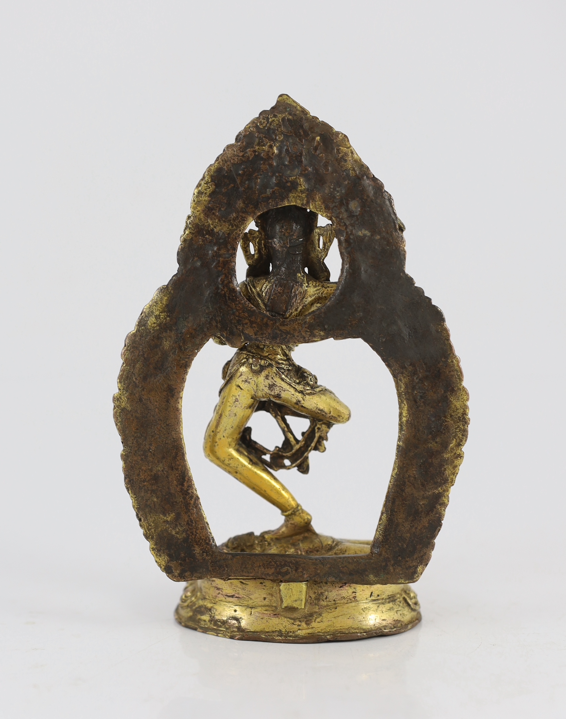 A Sino-Tibetan gilt bronze figure of a deity, possibly 17th/18th century, 17 cm high